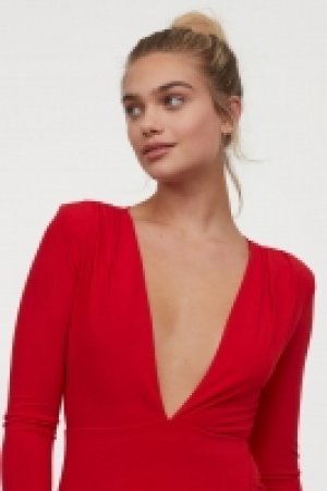  Kleid mit V-Ausschnitt 24.99 €